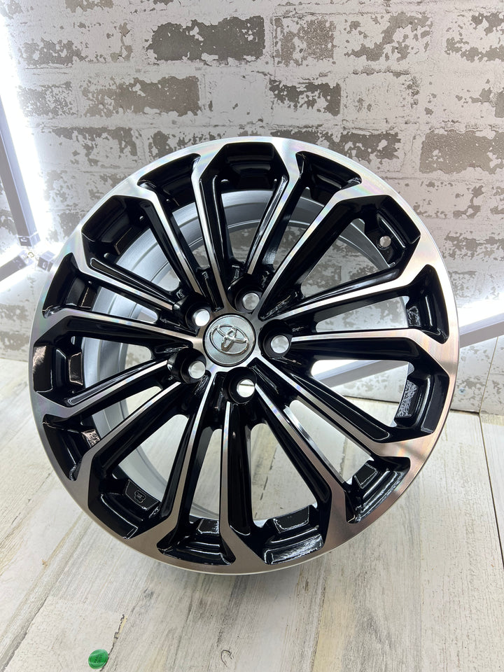 16"  Toyota Corolla Reps, gloss black and machine wheels